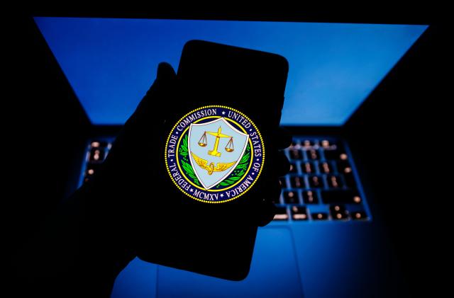 The Federal Trade Commission of the United States seal is displayed on a mobile phone screen for illustration photo. Krakow, Poland on February 2nd, 2023.  (Photo by Beata Zawrzel/NurPhoto via Getty Images)