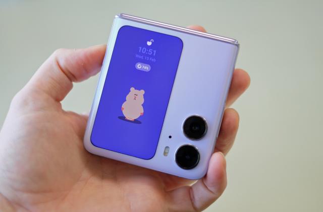 Image of the Find N2 Flip closed, showing the cover display featuring an animated hamster.