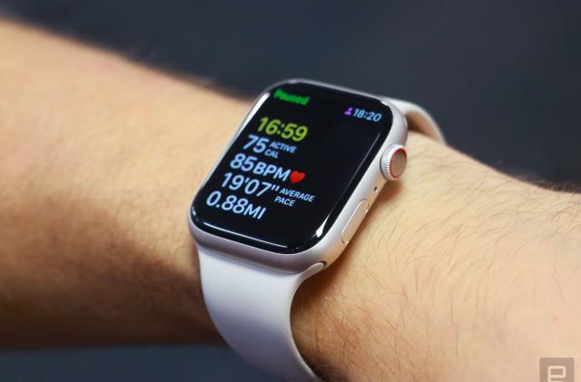 The Apple Watch Series 8 on a person's wrist, showing a paused workout tracking screen.