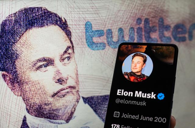 Elon Musk Twitter account  seen on Mobile with Elon Musk in the background on screen, seen in this photo illustration. On 19 February 2023 in Brussels, Belgium. (Photo illustration by Jonathan Raa/NurPhoto via Getty Images)