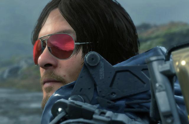 A still from the video game 'Death Stranding' showing the closeup of a character wearing red-tinted sunglasses.
