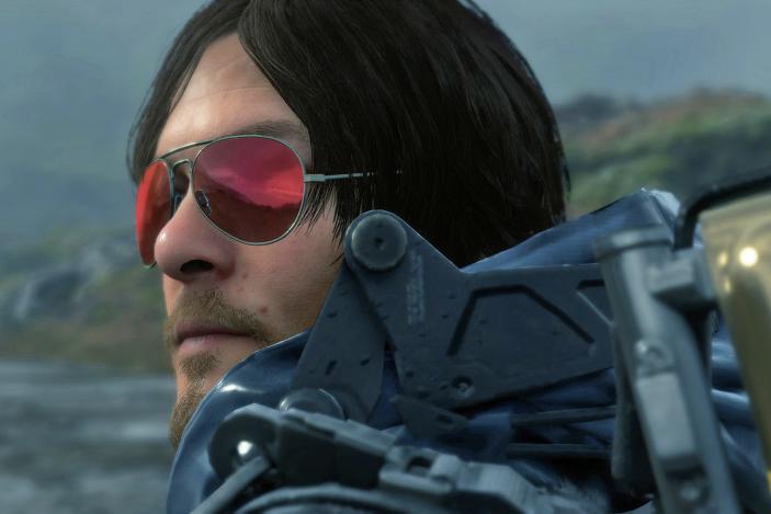 A still from the video game 'Death Stranding' showing the closeup of a character wearing red-tinted sunglasses.