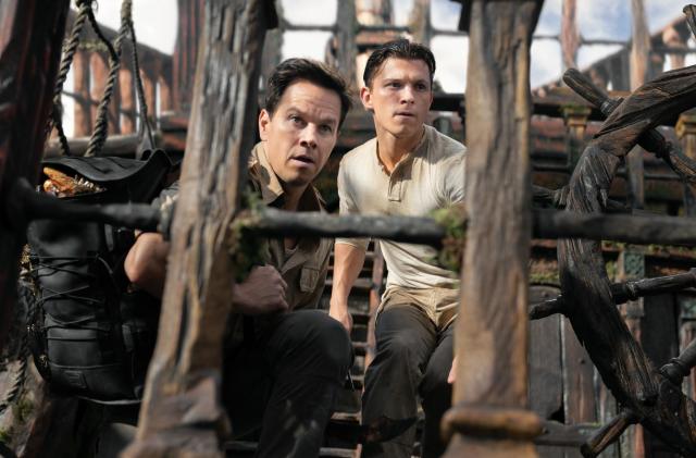 Tom Holland as Nathan Drake, Mark Wahlberg as Sully in the Uncharted movie.