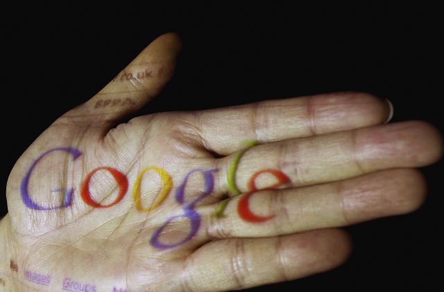 GLASGOW, UNITED KINGDOM - APRIL 12: In this photo illustration, the logo of the multi-facetted internet giant Google is seen projected onto the palm of a hand on April 12, 2006, in Glasgow, Scotland.  (Photo illustration by Jeff J Mitchell/Getty Images)