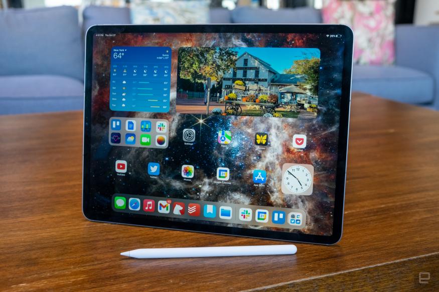 A 12.9-inch iPad Pro sitting on a table with an Apple Pencil in front of it.