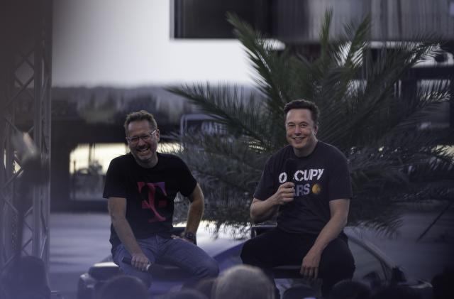 BOCA CHICA BEACH, TX - AUGUST 25: SpaceX founder Elon Musk and T-Mobile CEO Mike Sievert on stage during a T-Mobile and SpaceX joint event on August 25, 2022 in Boca Chica Beach, Texas. The two companies announced plans to work together to provide T-Mobile cellular service using Starlink satellites. (Photo by Michael Gonzalez/Getty Images)