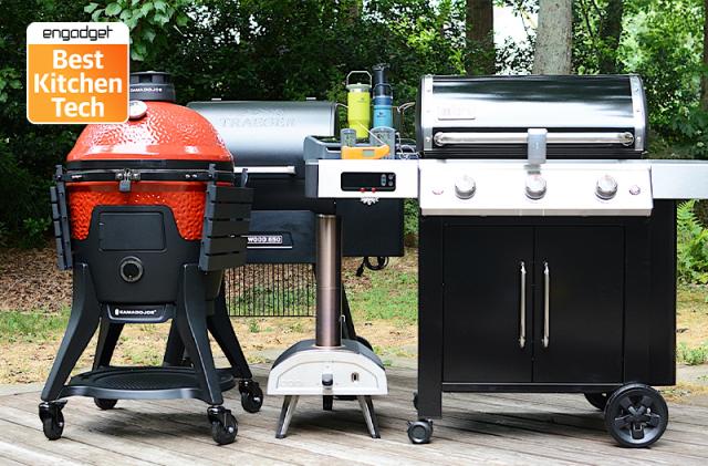 A group of outudoor grills on someone's backyard porch, along with a pizza oven, plus the Engadget Best Kitchen Tech badge on the top left corner.
