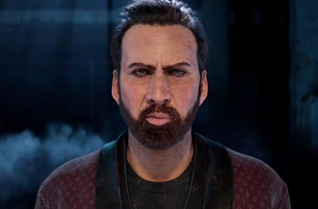 Shadowy closeup of Nicolas Cage from the shoulders up in ‘Dead by Daylight.’ He is staring at the camera with an intense and perhaps unsettling glare. Darkness and hints of smoke hover in the background.